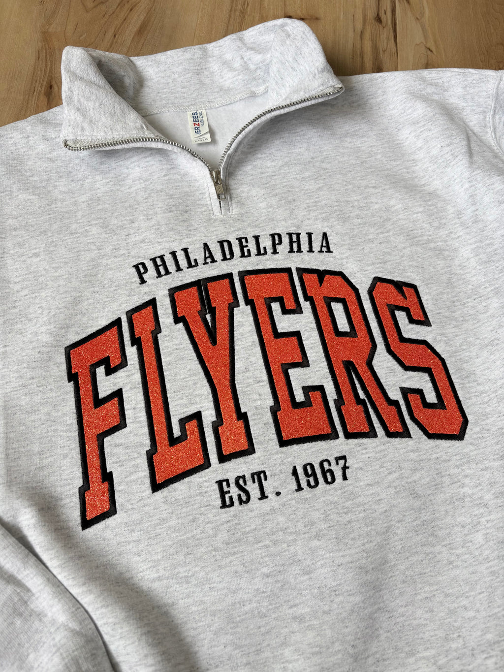 Flyers Quarter Zip Sweatshirt with Embroidered Glitter Applique